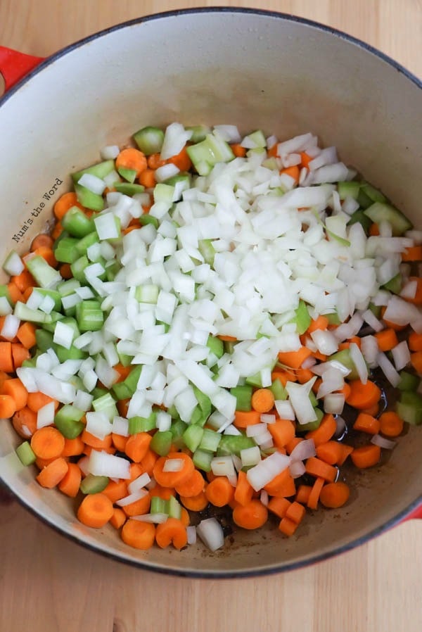 Ham Bone & Vegetable Soup - carrots, onion and celery in pot with bacon grease