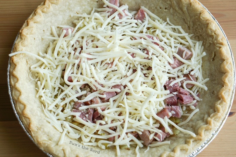 Ham & Cheese Quiche - cheese on top of ham.