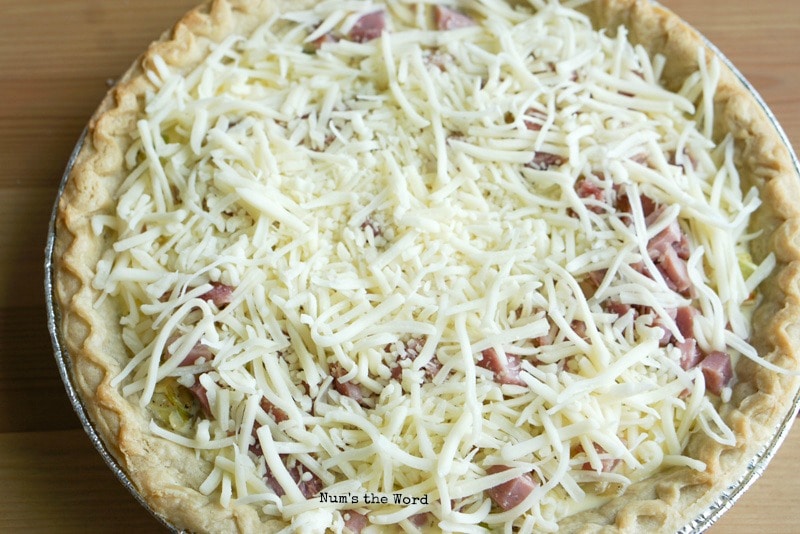 Ham & Cheese Quiche - second layer of ham, onion & cheese on top of initial layers.