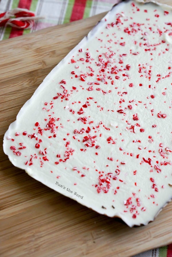 Homemade Peppermint Bark - sheet of peppermint bark on a cutting board.