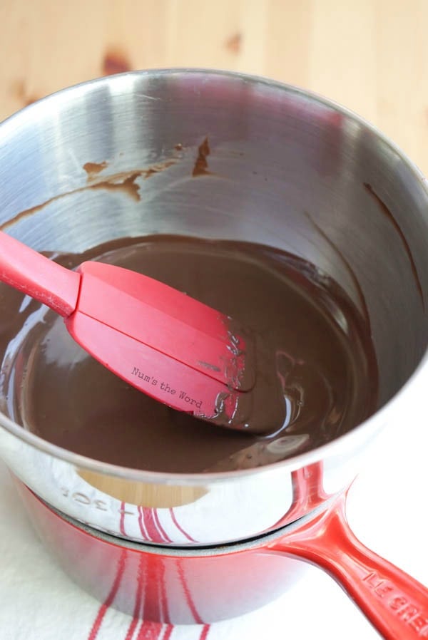 Homemade Peppermint Bark - melted chocolate in a bowl with peppermint extract