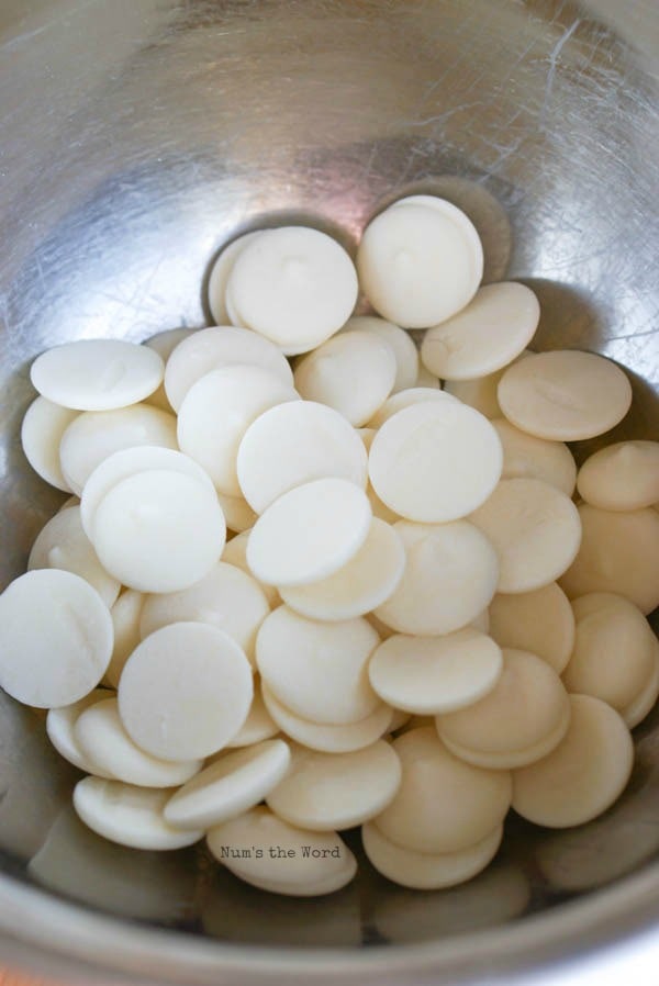 Homemade Peppermint Bark - white chocolate melting wafers in a bowl.