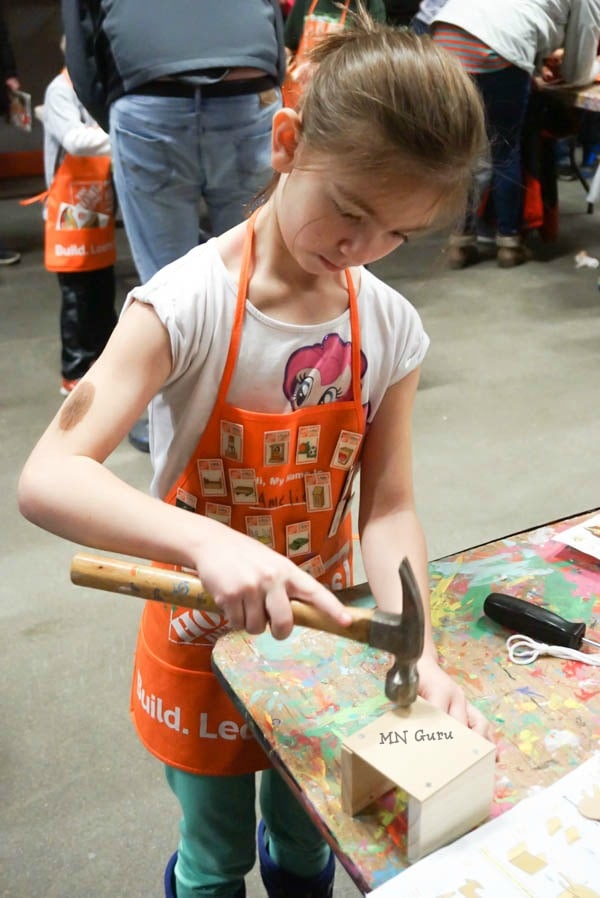 Home Depot Kids Workshop - hammering in the nails for the monthly project.