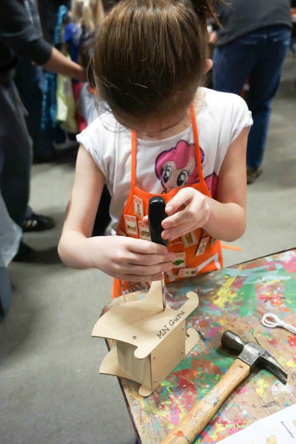 Home Depot Kids Workshop - using a screw driver to connect pieces of project