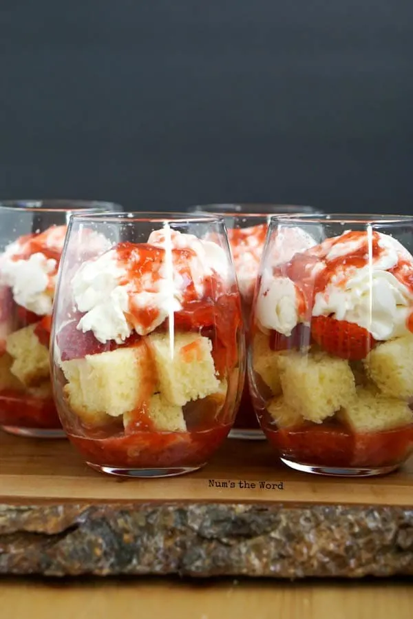 Strawberry Shortcake Trifle Cups - strawberry sauce placed on top of whipped cream