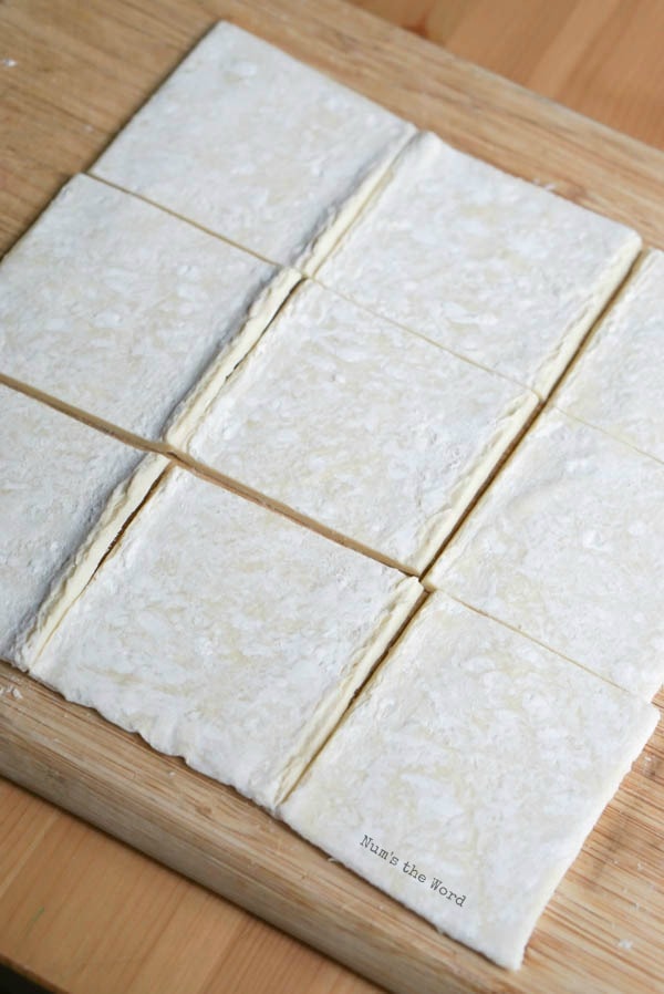 Lime Curd Puff Pastry Cups - puff pastry sheet laid out on cutting board and cut into squares