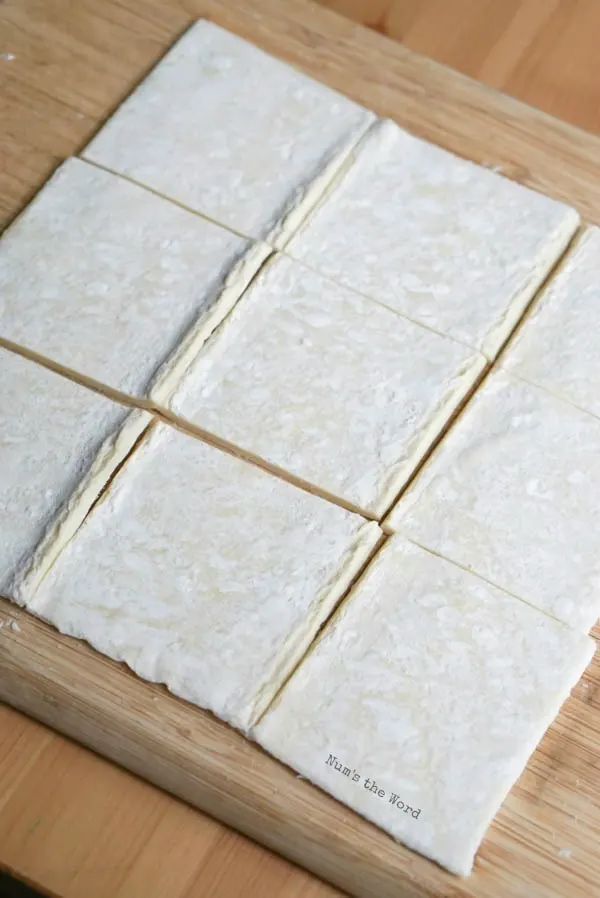 Lime Curd Puff Pastry Cups - puff pastry sheet laid out on cutting board and cut into squares