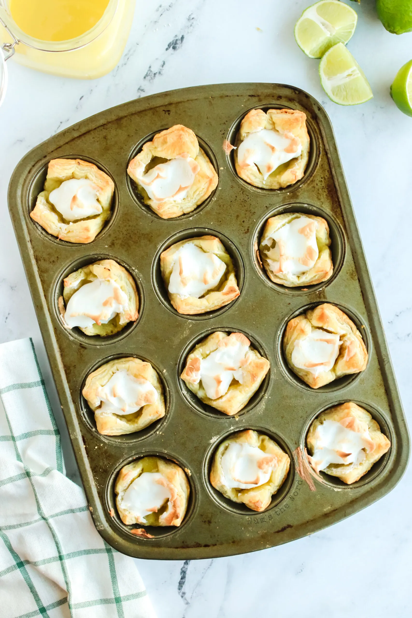 baked meringue cups in muffin tin.