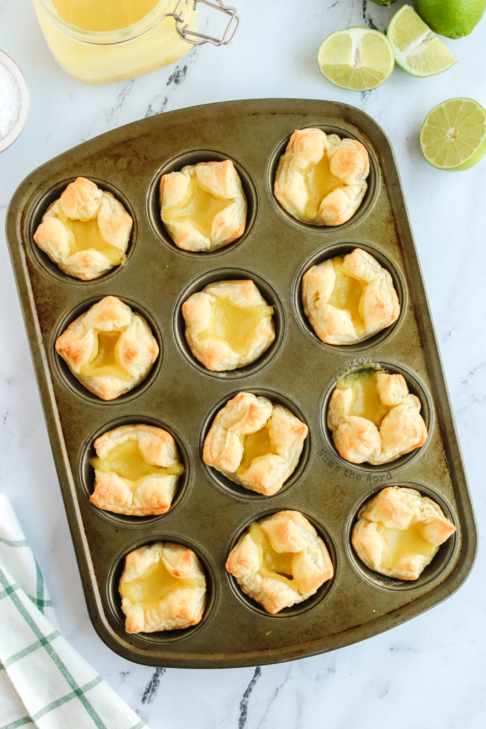 lime curd puff pastry cups baked but still in muffin cups