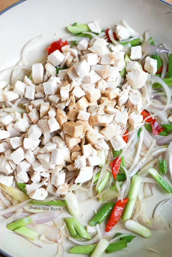 Indonesian Fried Rice - cooked chicken and soy sauce added to pan