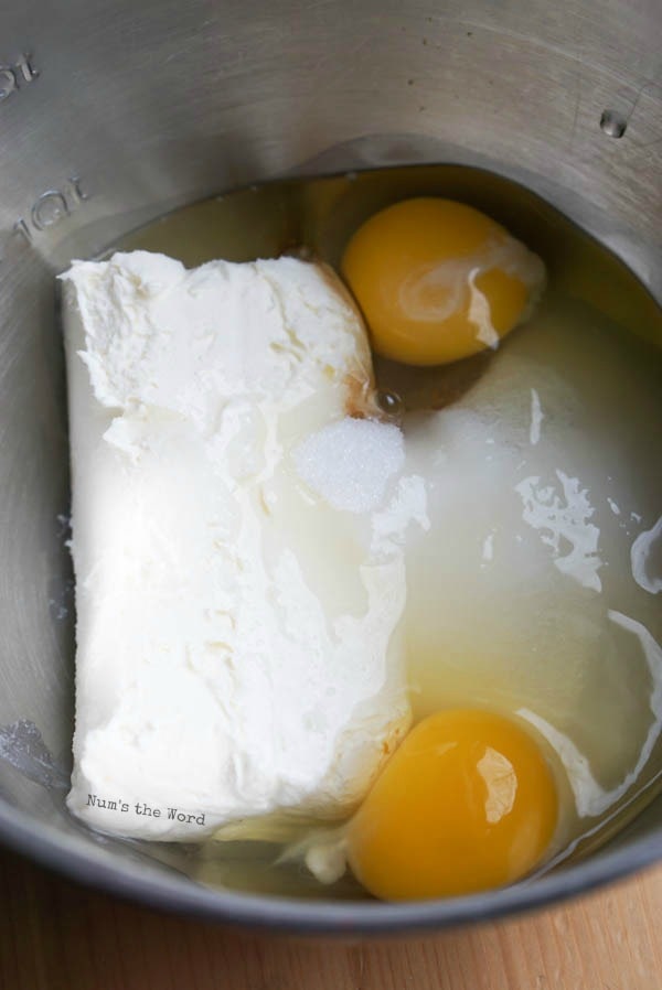 eggs and cream cheese in a bowl ready to be blended