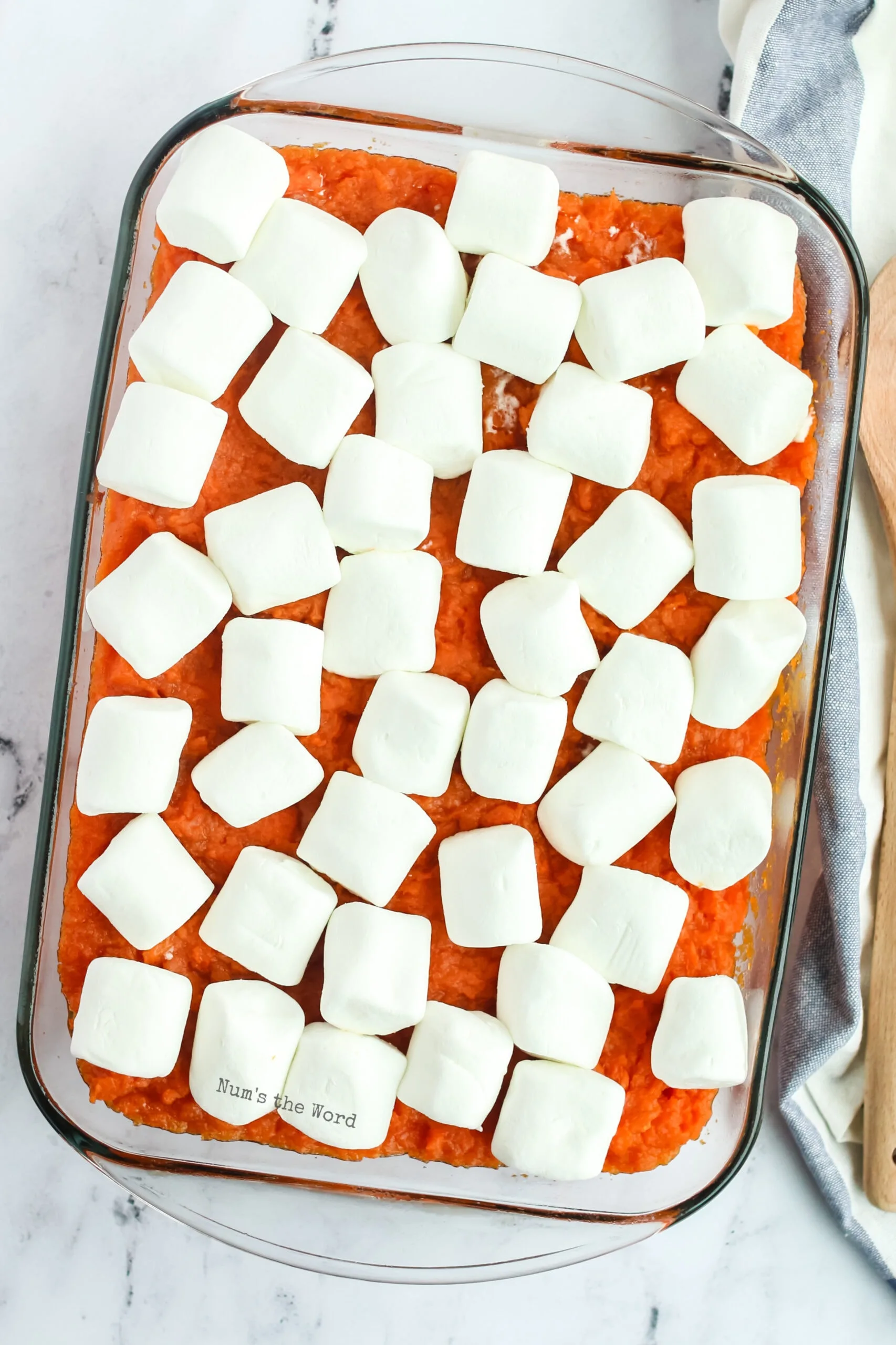 large marshmallows placed on top of the mashed sweet potatoes, not baked