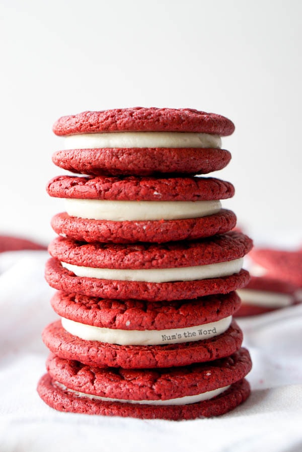 Red Velvet Cake Mix Cookies - red velvet whoopie pies stacked up showing yummy cream cheese frosting centers