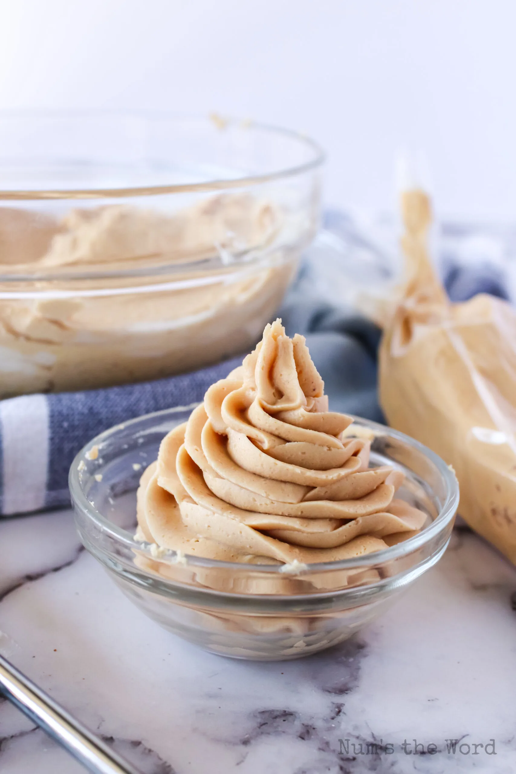 peanut butter frosting piped into a bowl