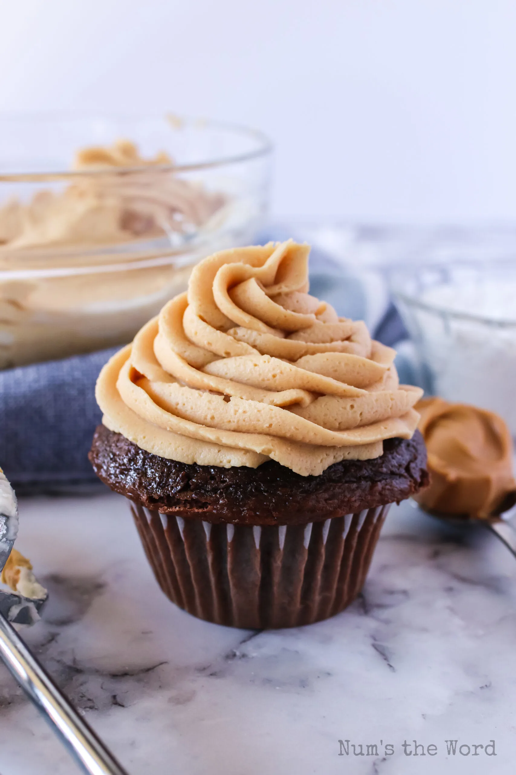peanut butter frosting on a chocolate cupcake