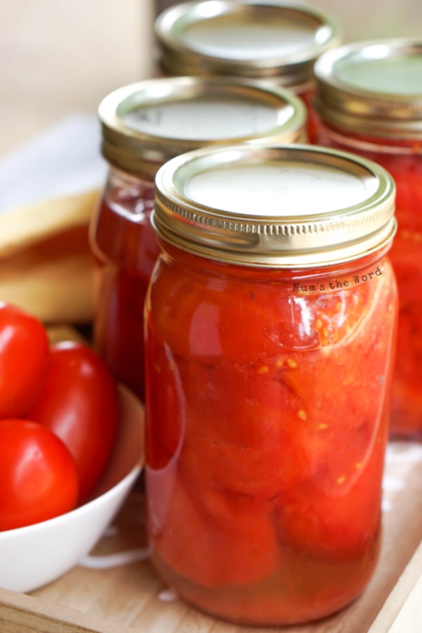 Canned Tomatoes - close up of canned tomatoes ready to be stored for the winter