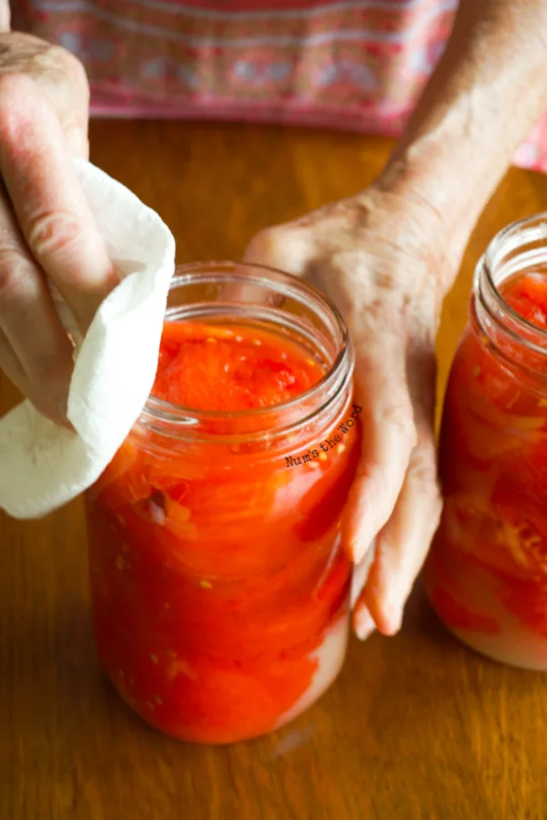 cleaning the rims of the jars