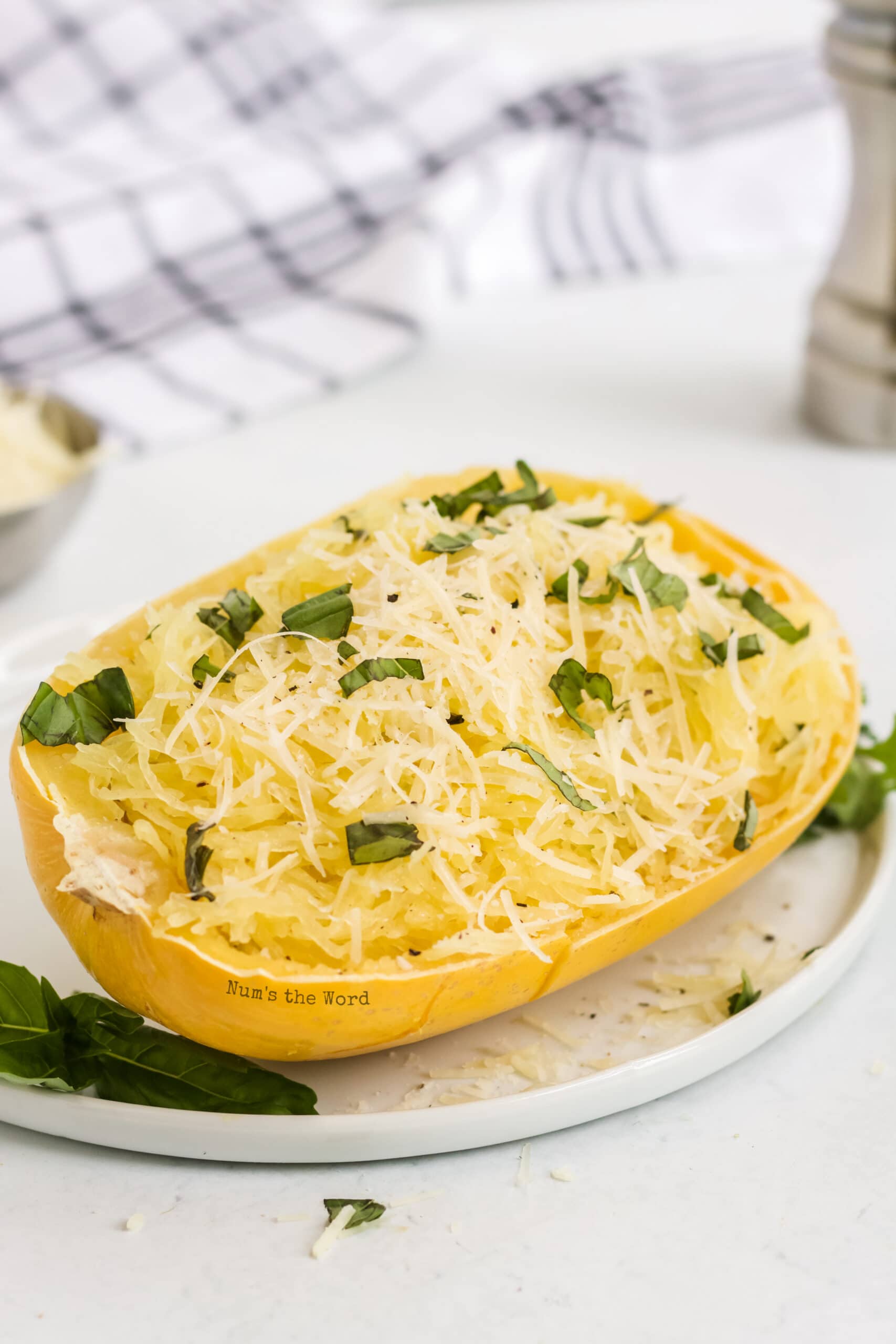 zoomed out image of half a spaghetti squash ready to be eaten.