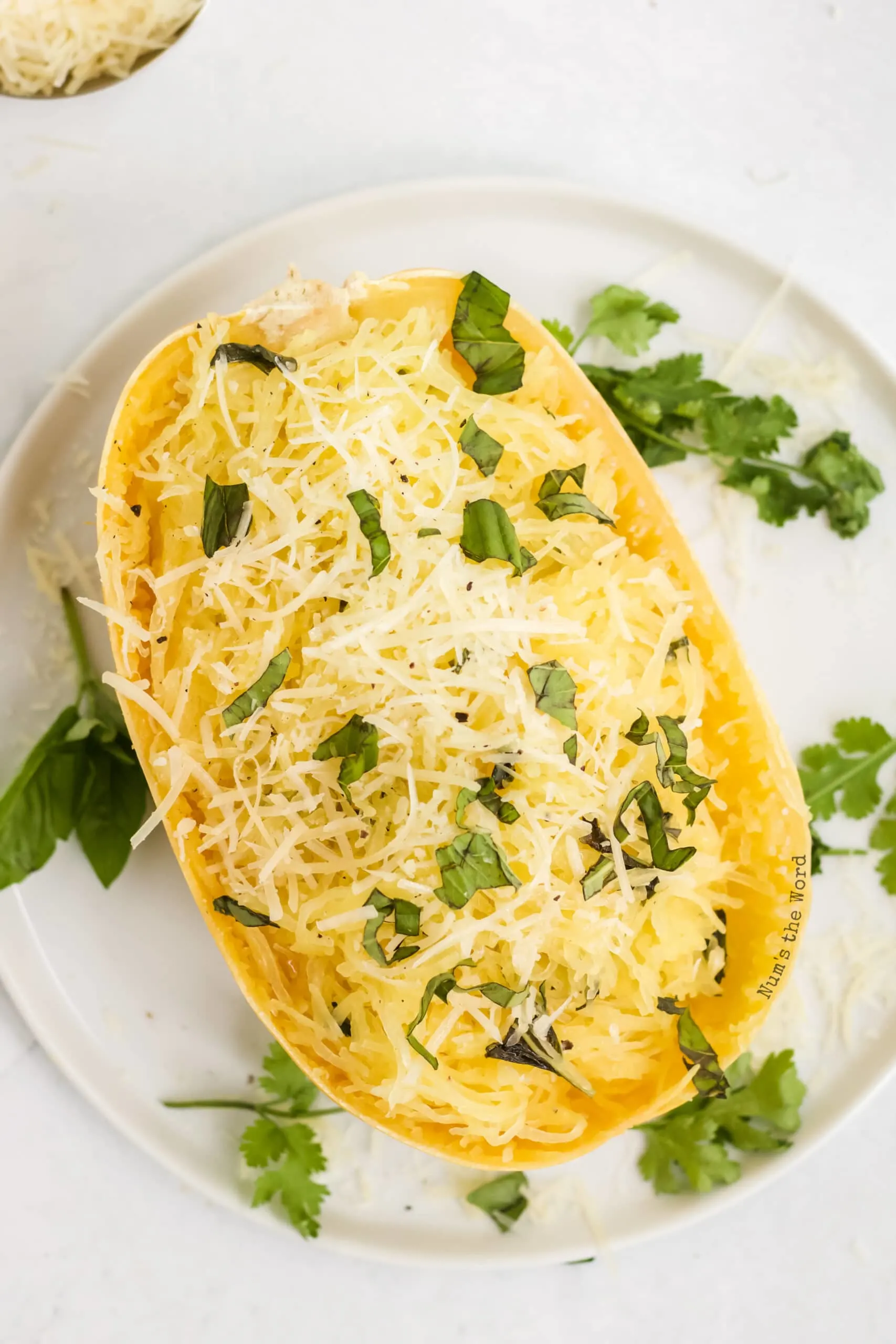 top view of squash ready to be eaten with cheese and basil on top