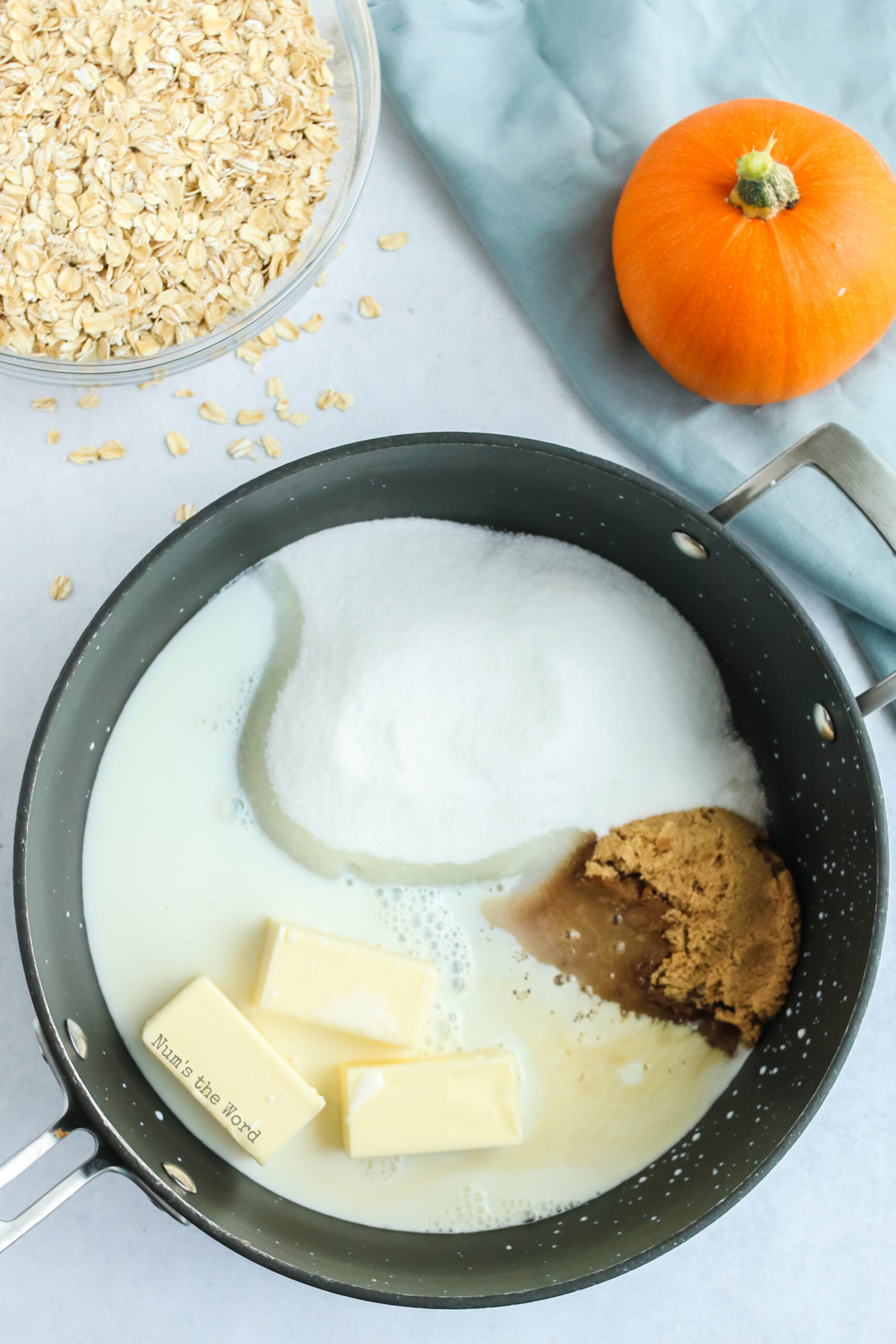 white sugar, brown sugar, butter and milk in a pot, uncooked.