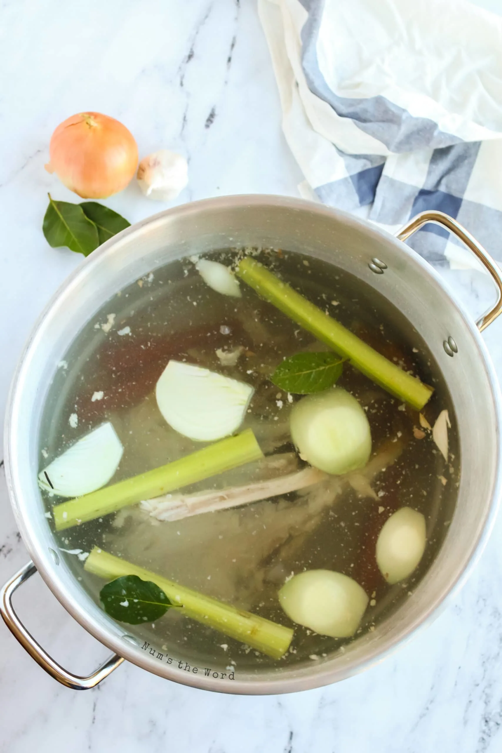 water added to turkey bones and vegetables in large pot