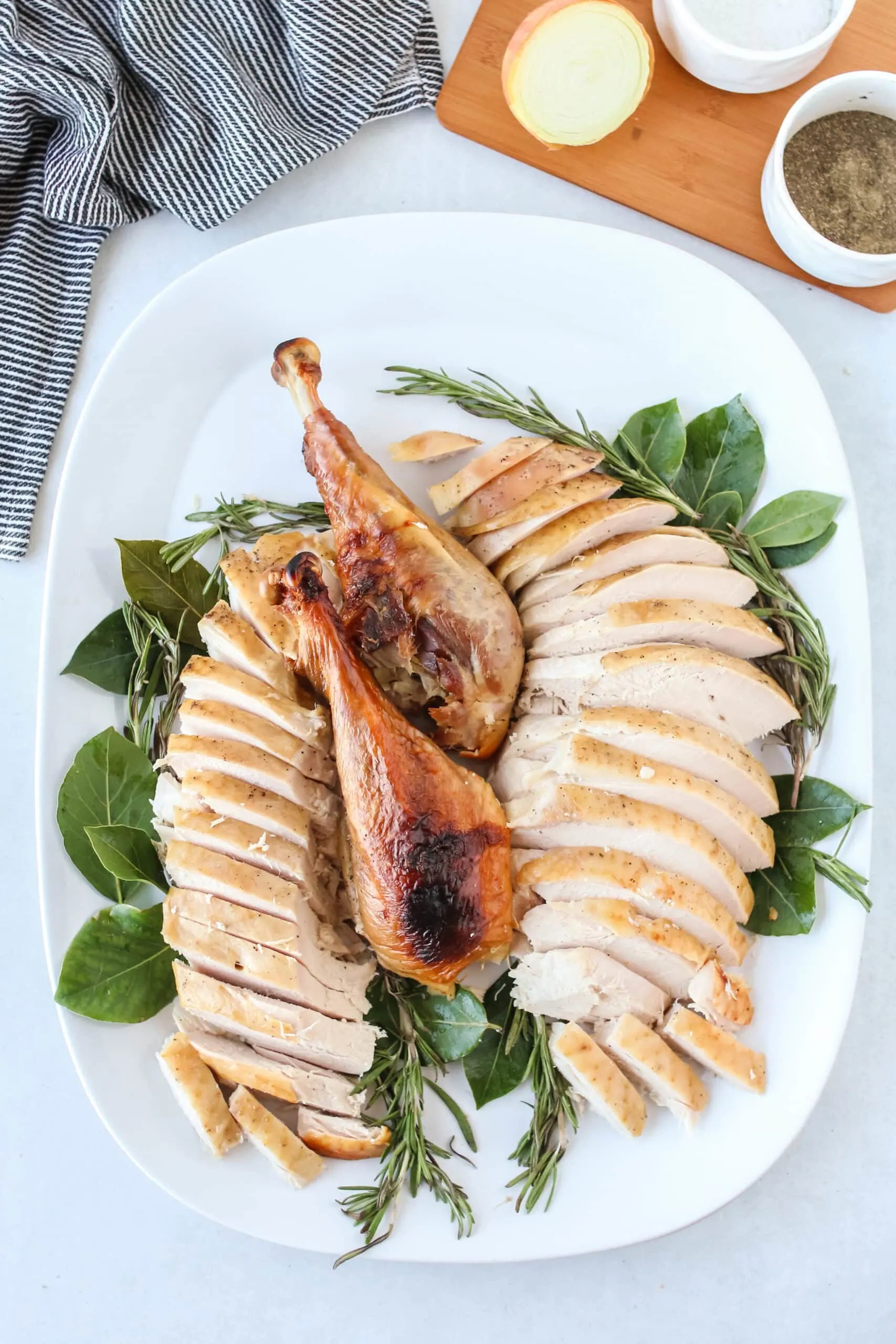 carved turkey on a platter and ready to serve, zoomed out image