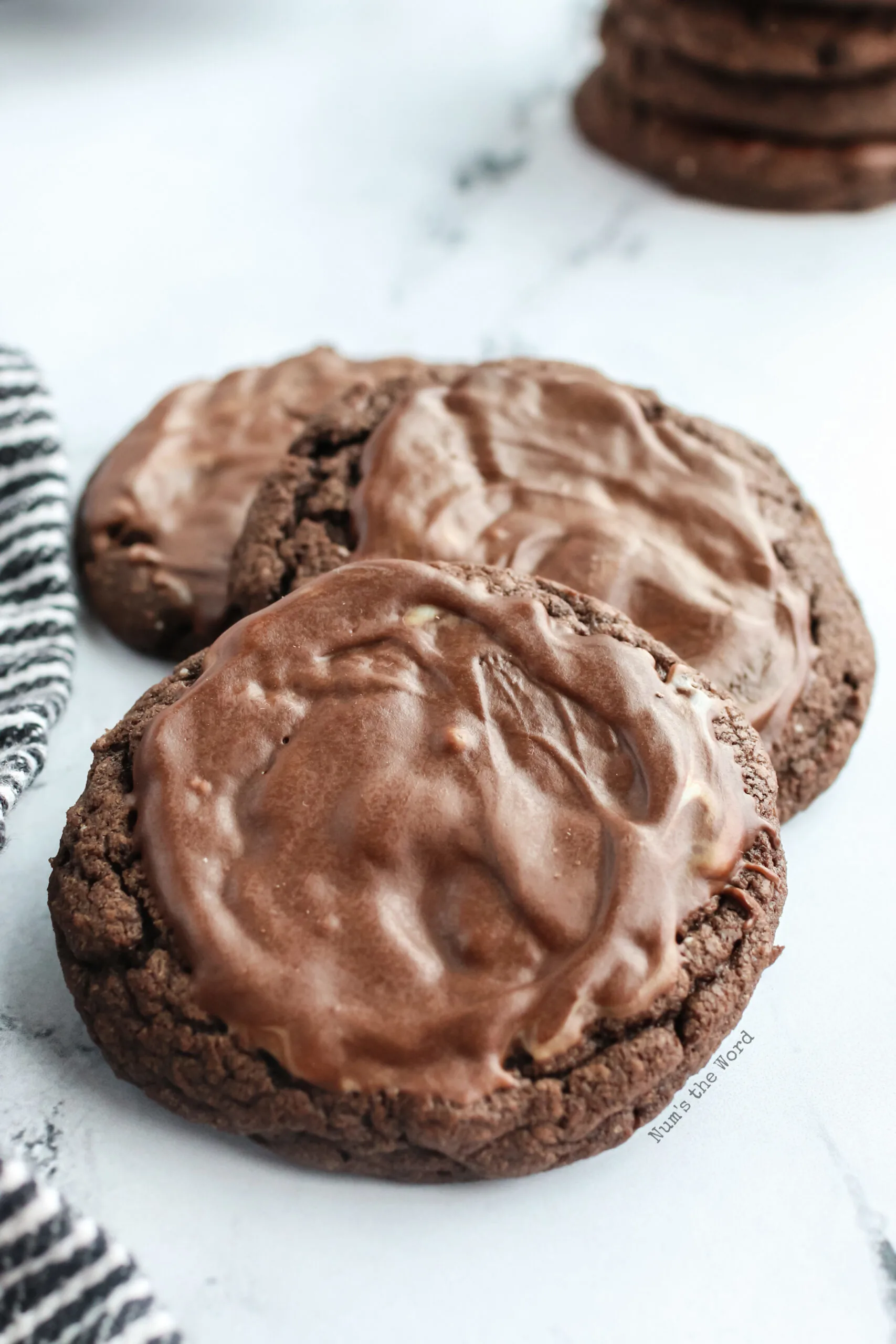 3 cookies on a counter, ready to eat