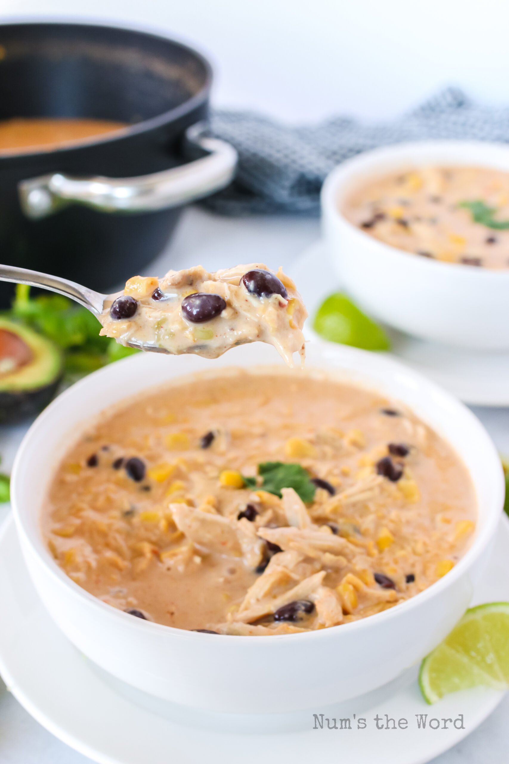 chowder in a bowl with a spoon scooping a portion out.