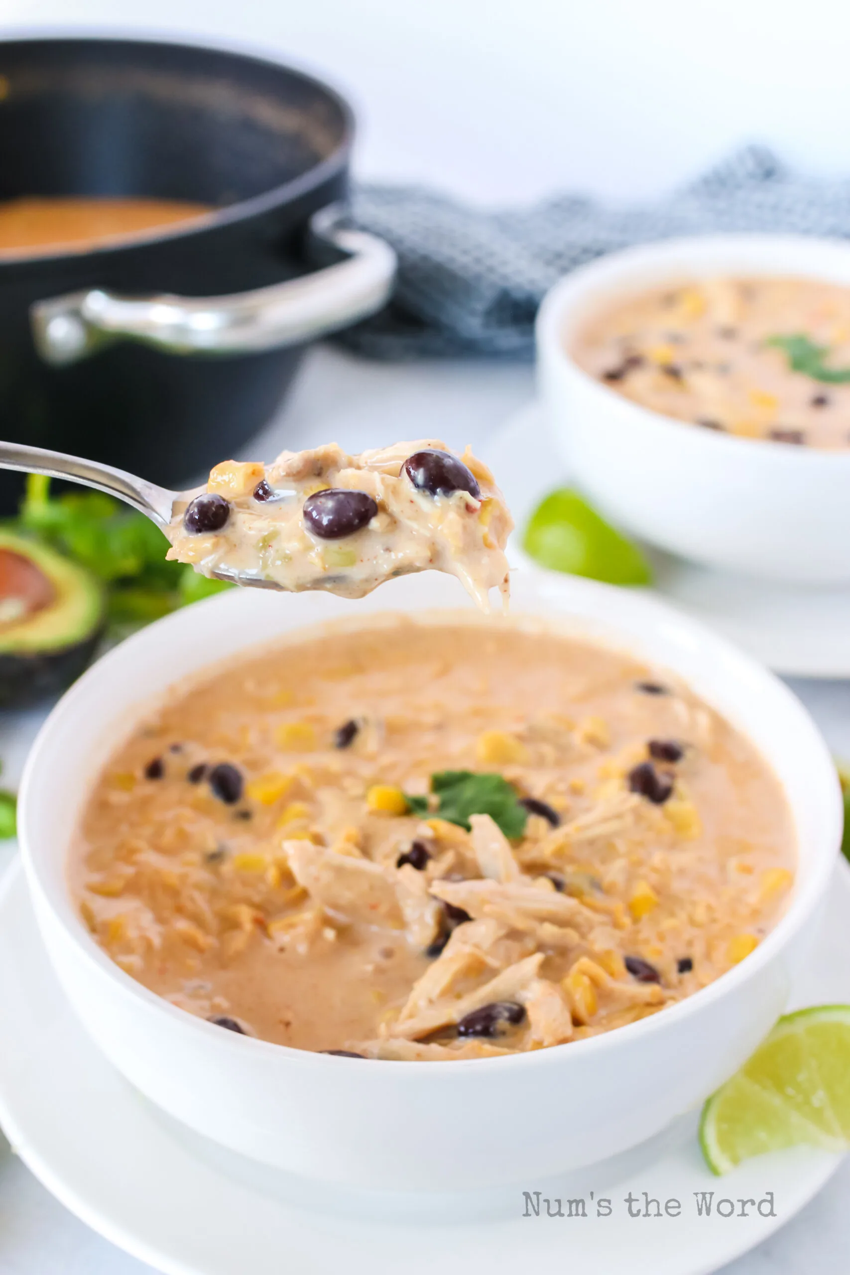 chowder in a bowl with a spoon scooping a portion out.