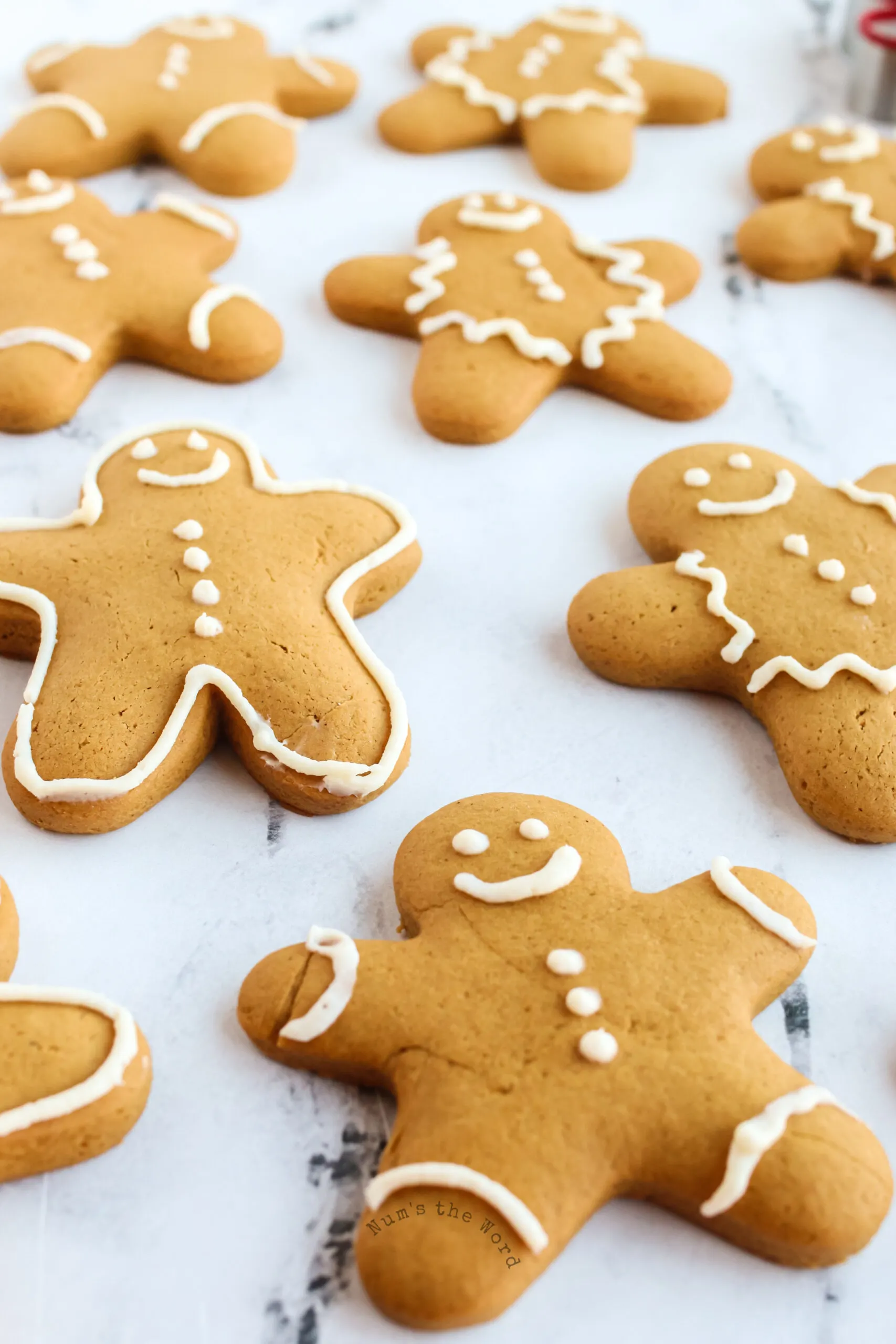 top side view of decorated gingerbread cookies on parchment paper