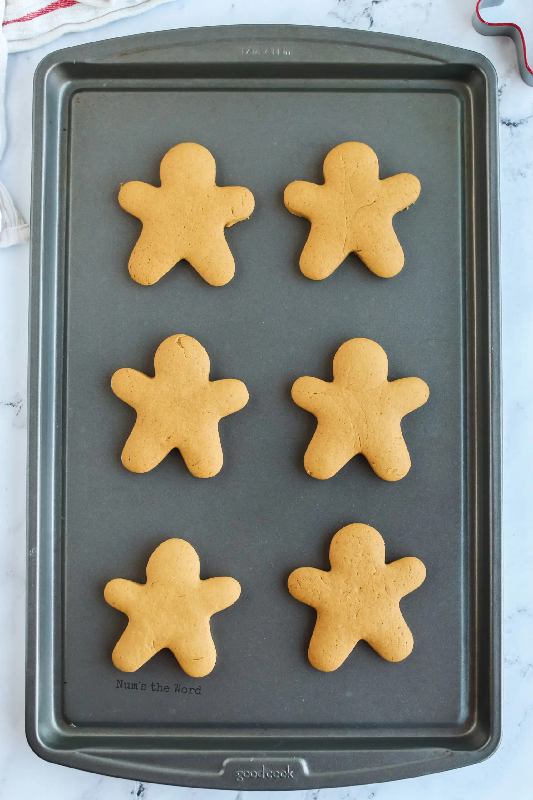 fresh baked gingerbread cookies on a cookie sheet - view from the top