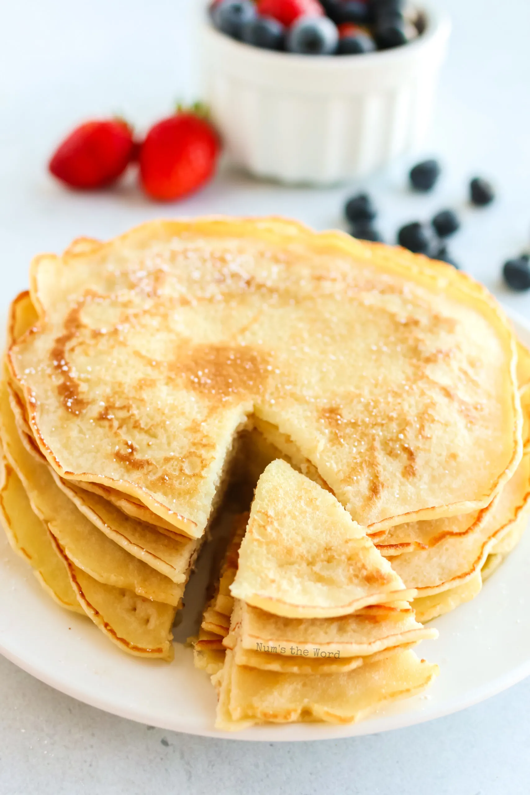 a slice taken out of pancakes ready to be eaten