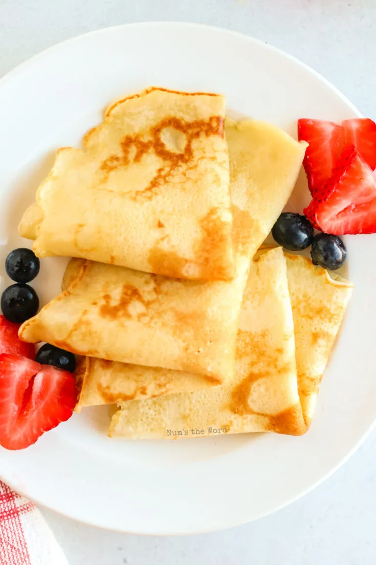 close up image of pancakes folded into triangles
