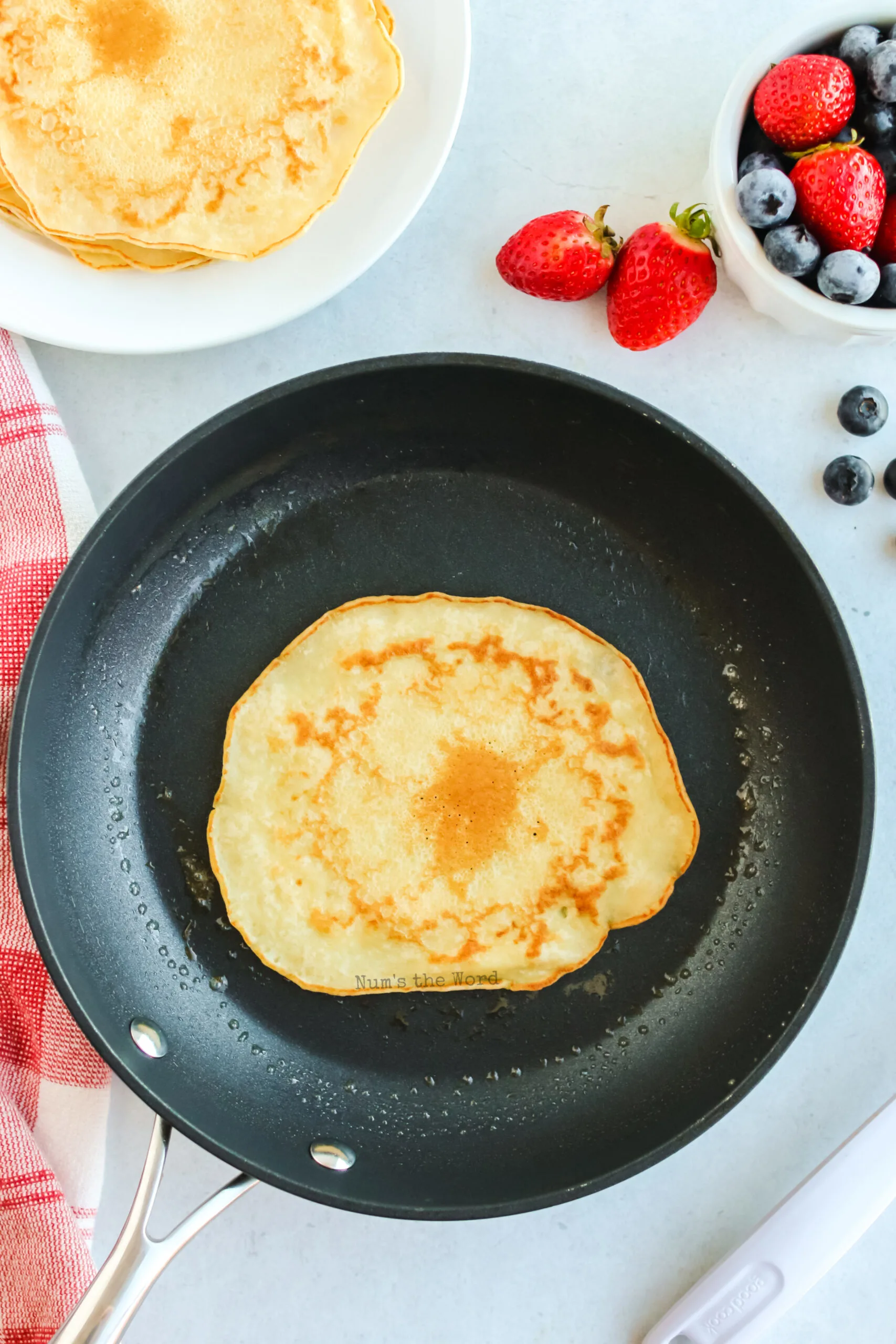 pancake flipped over to cook on other side