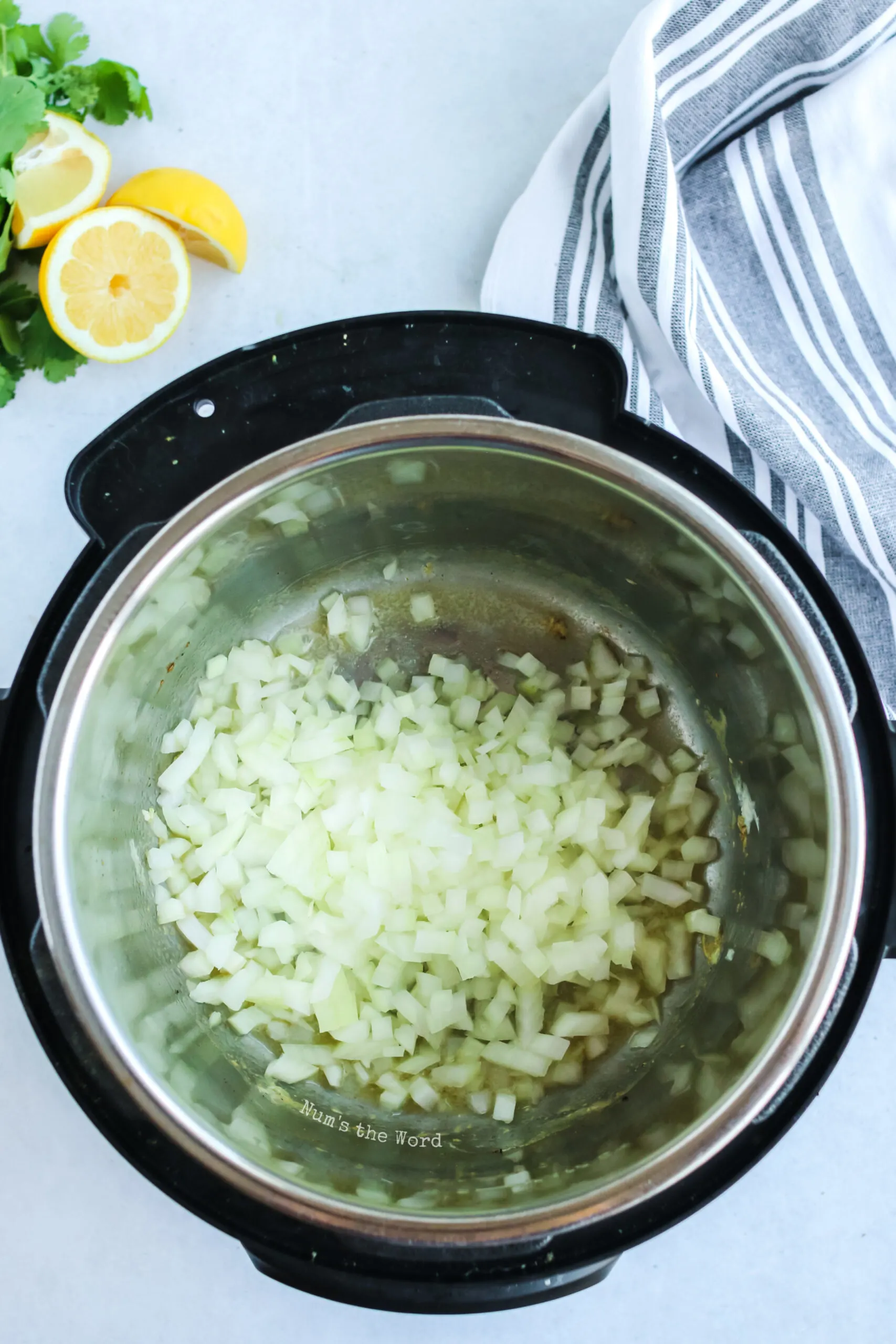 onions in instant pot ready to saute.