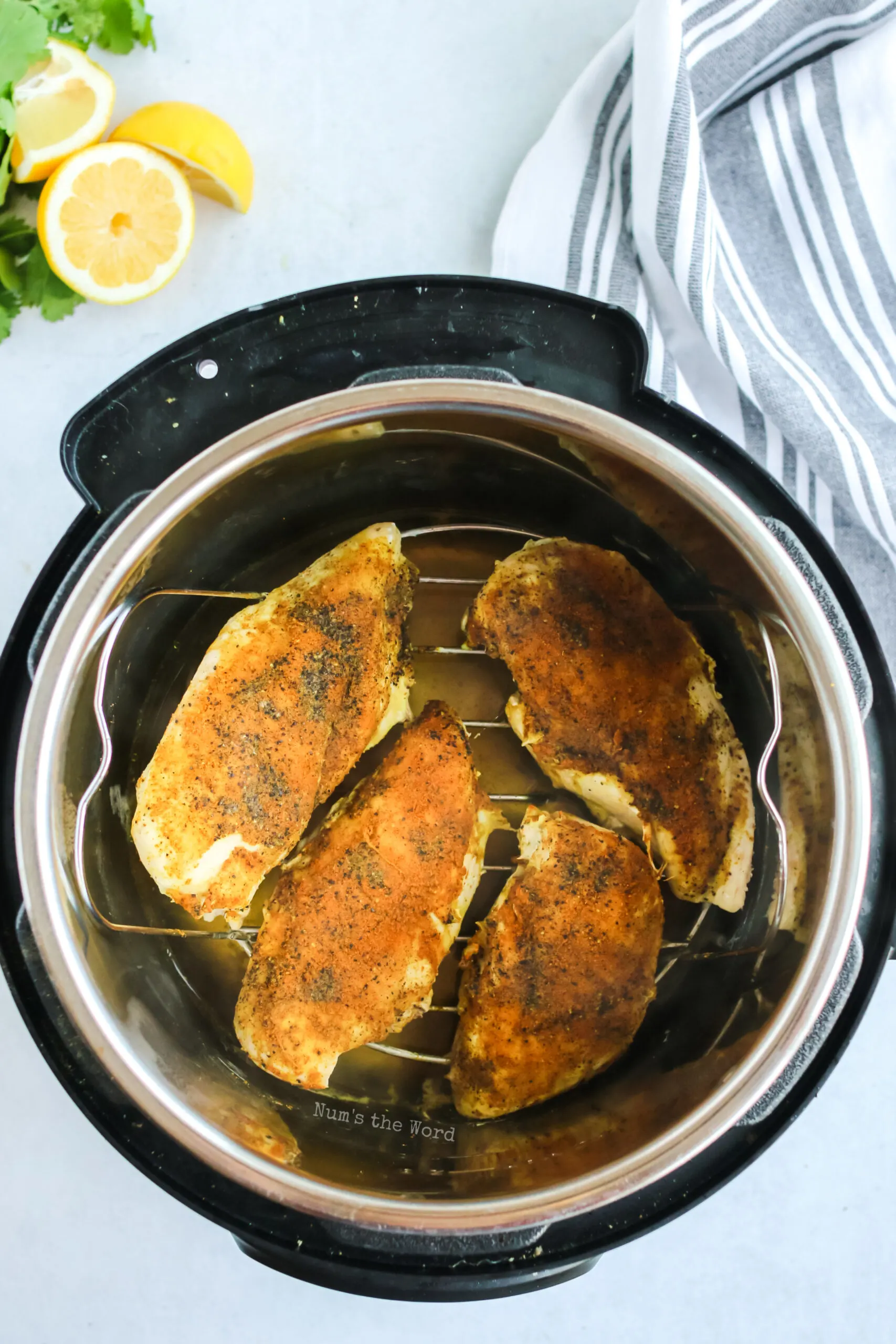 seasoned and cooked chicken inside instant pot