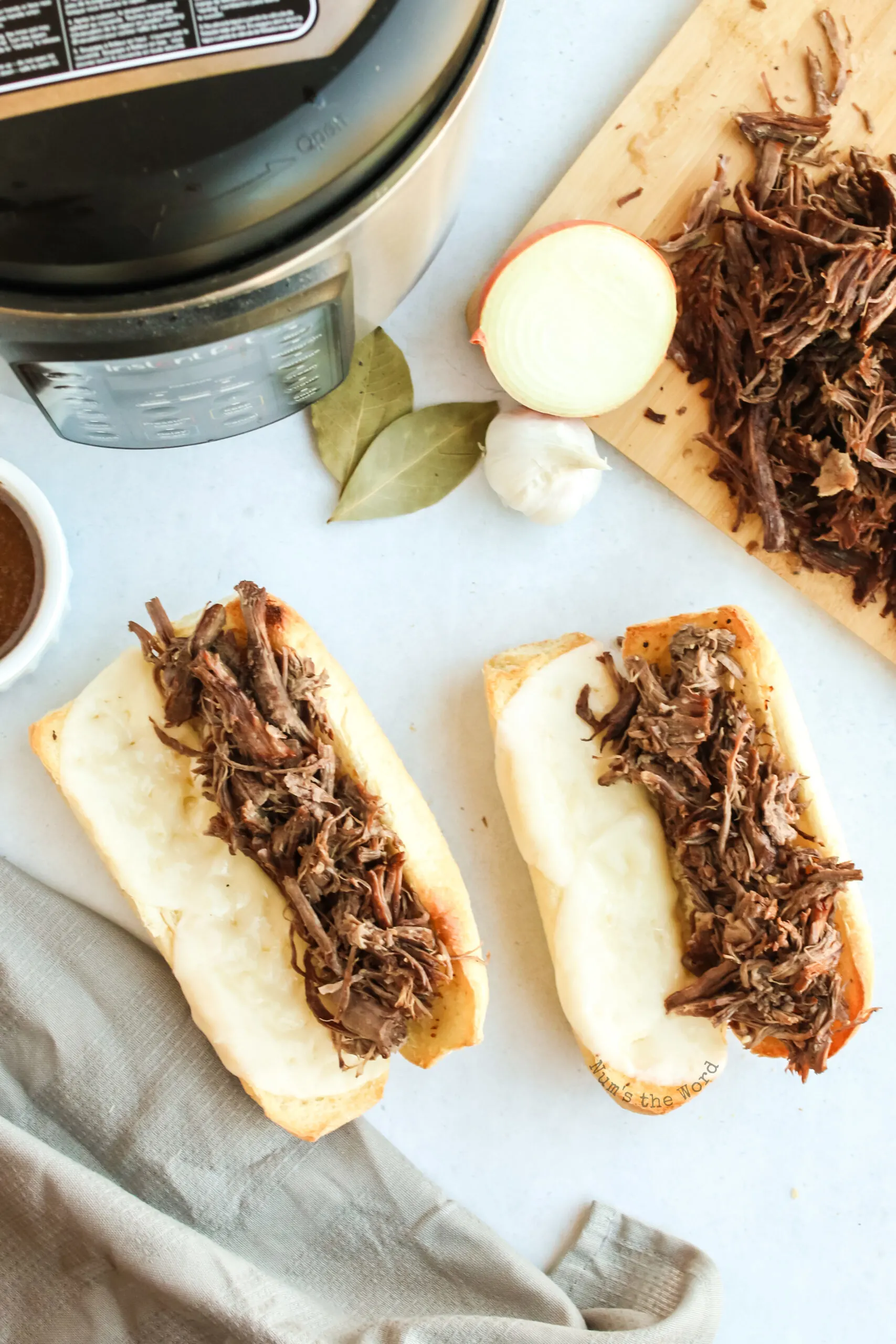 shredded beef place on sandwich buns