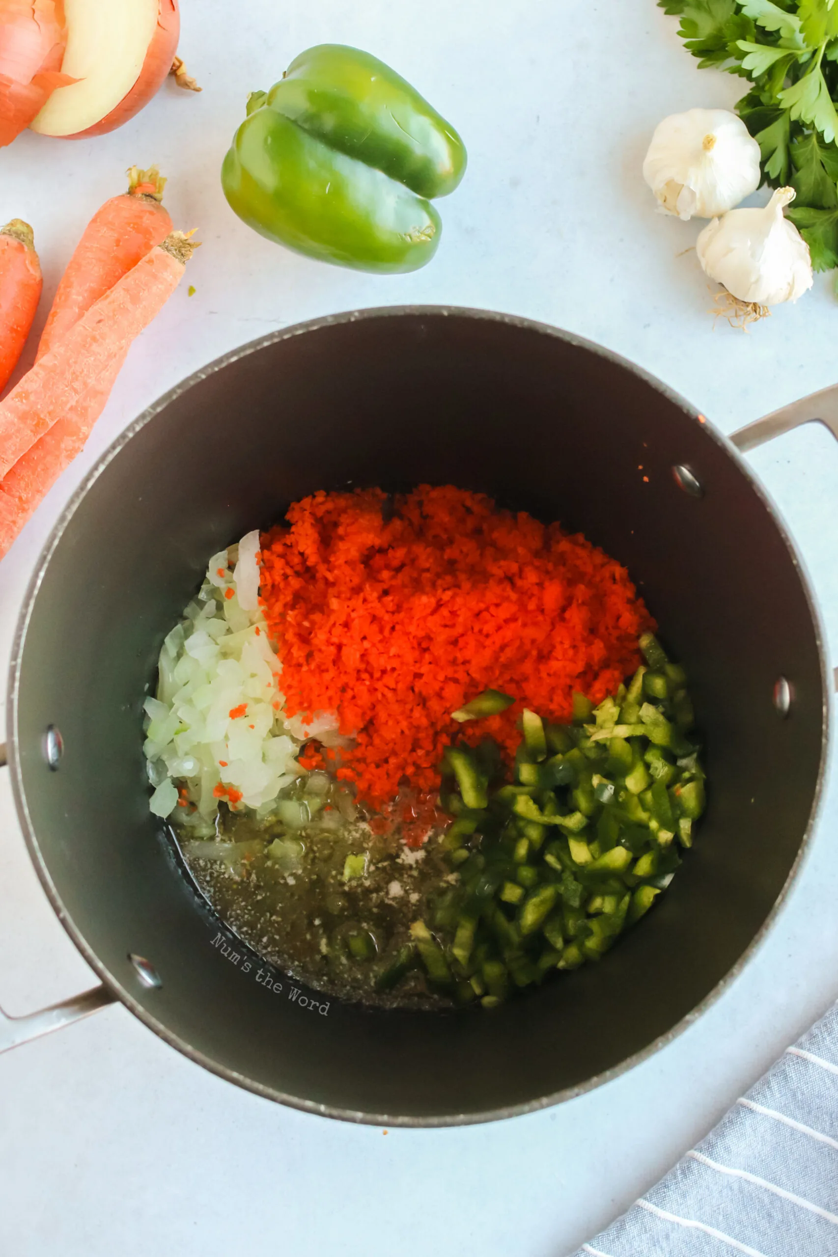 onion, carrots and bell pepper added to butter in pot