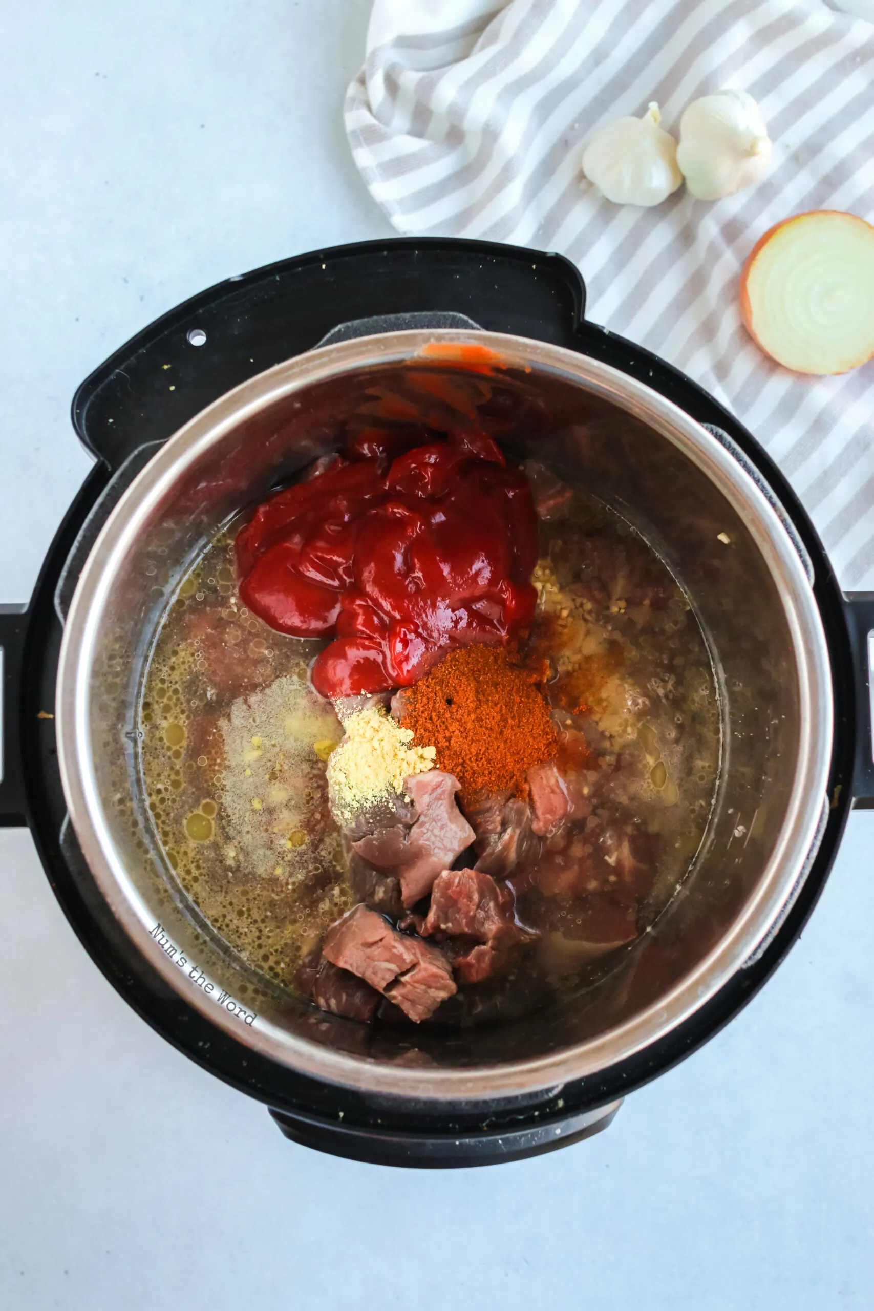 all ingredients added to instant pot except corn starch, ready to be cooked