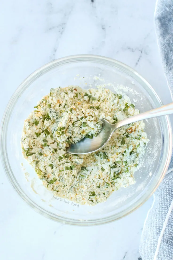 ranch seasoning mixed up in a bowl with a spoon in seasoning