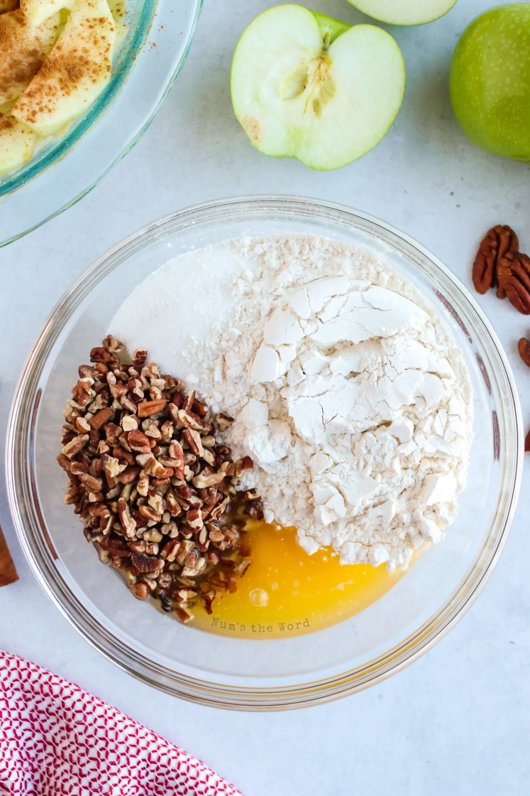 Butter, sugar, salt, egg, flour and almond extract in a bowl, ready to be mixed.