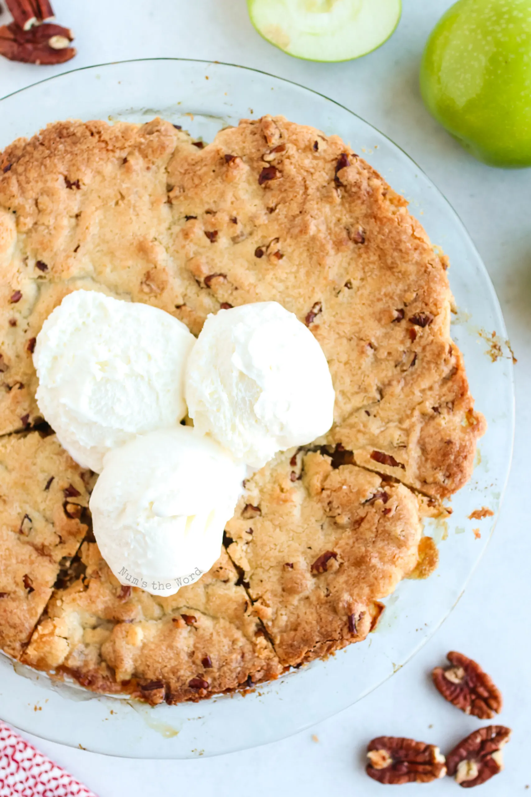 Apple Pie fresh from the oven with 3 scoops of ice cream on top.