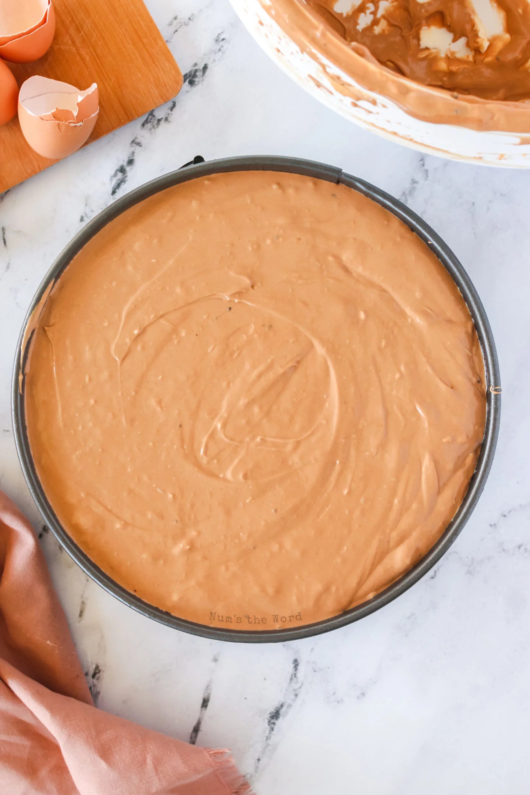 chocolate cheesecake mixture poured into pan.