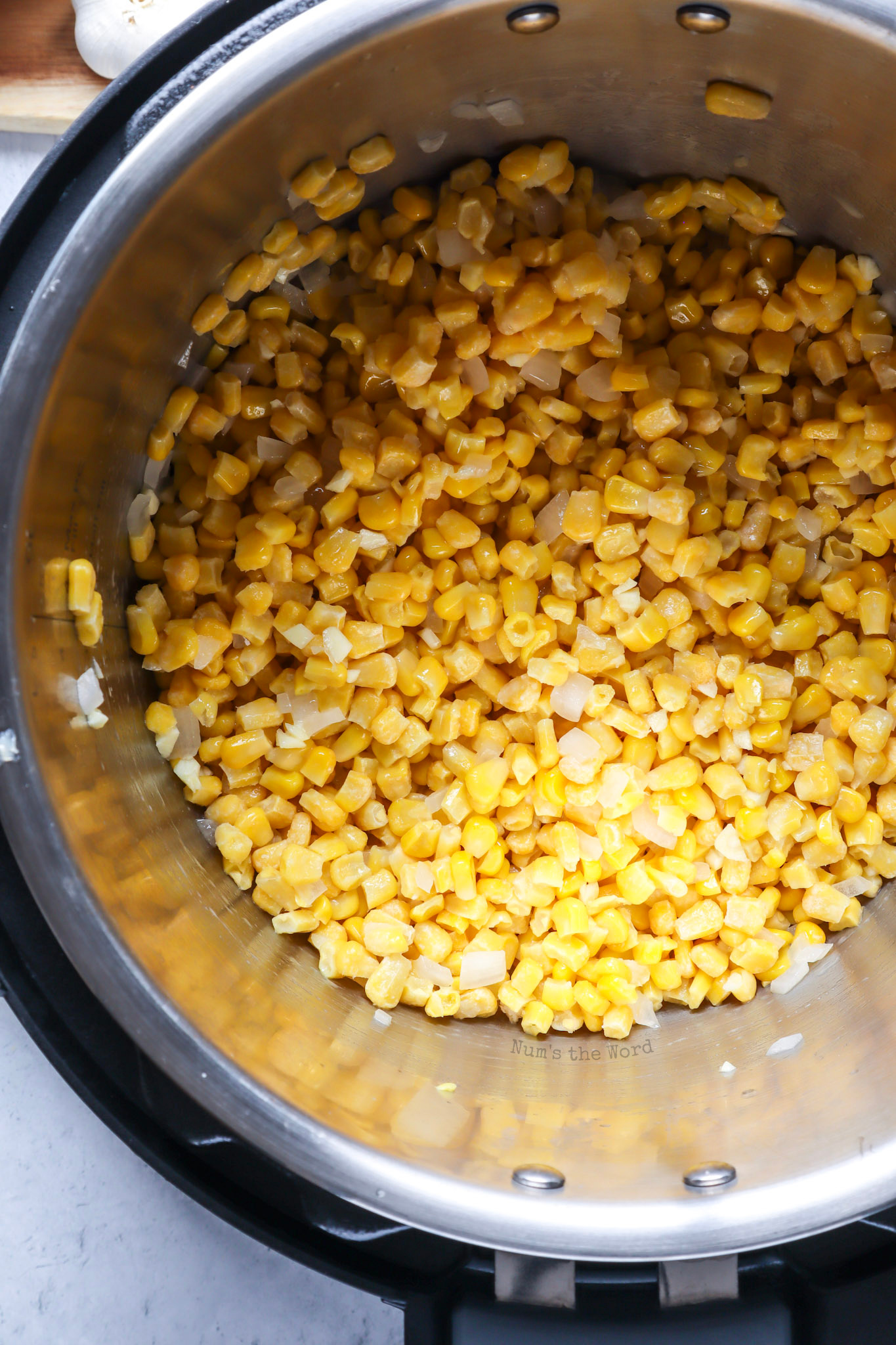 corn and onions added to melted butter. 