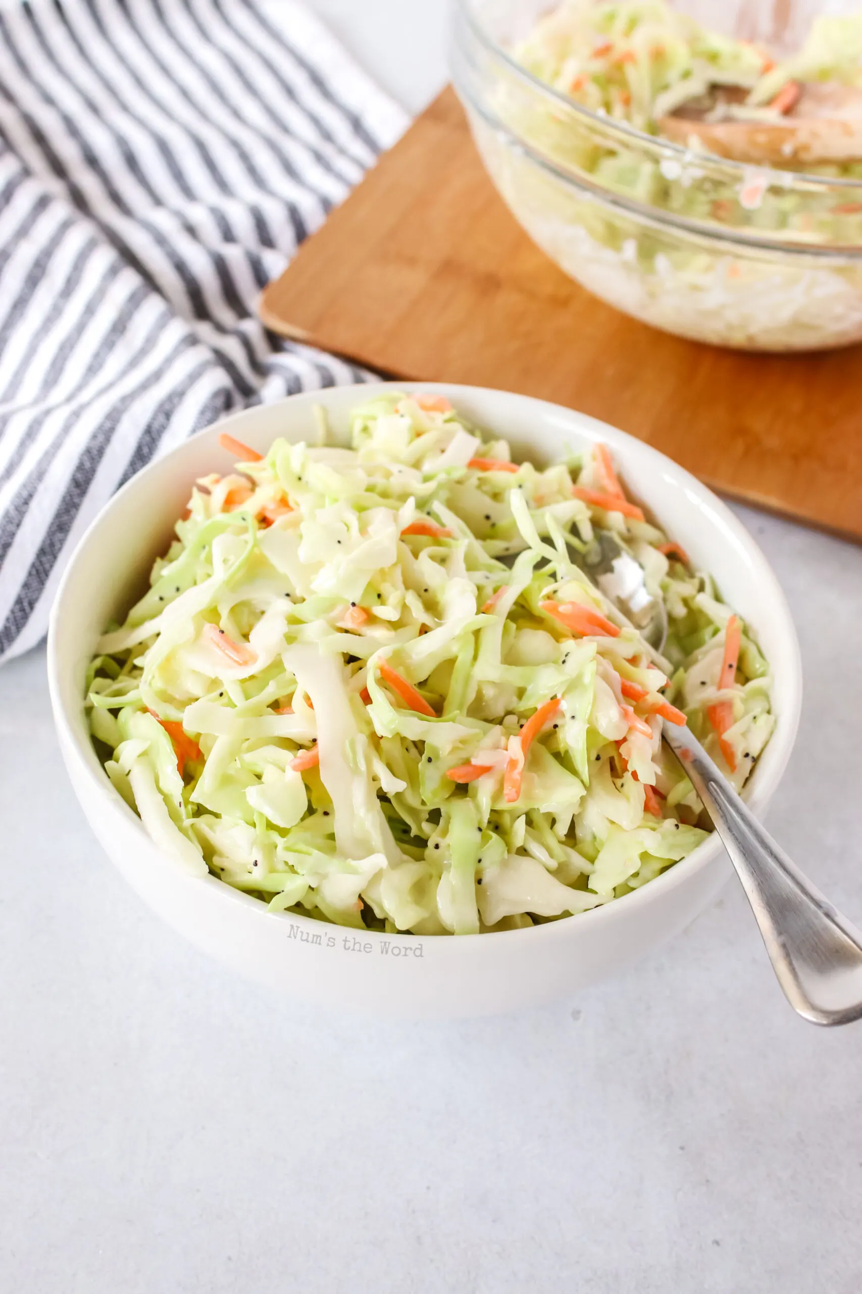 coleslaw in a bowl ready to eat with a spoon