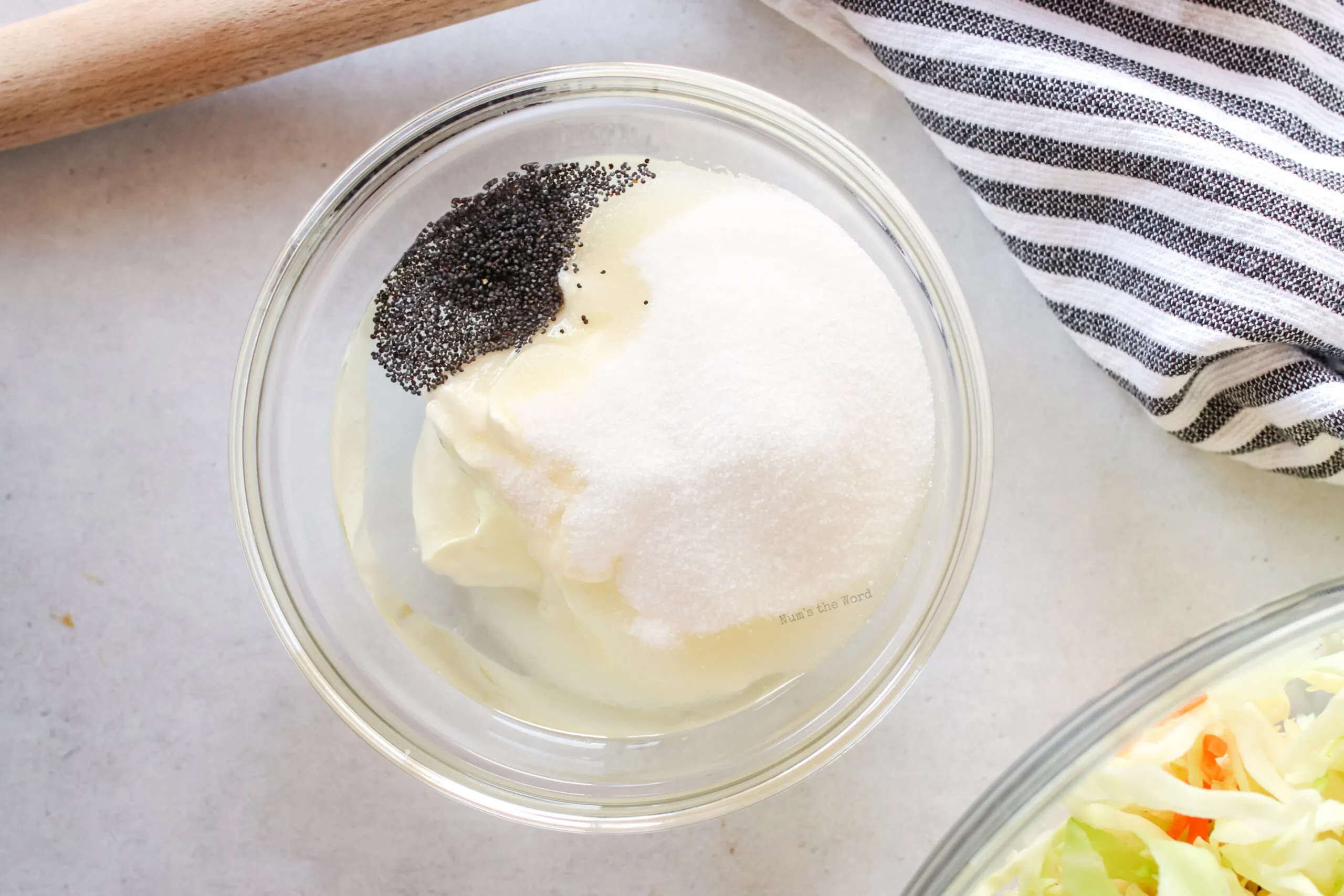 All coleslaw dressing ingredients in a bowl, ready to be mixed together.