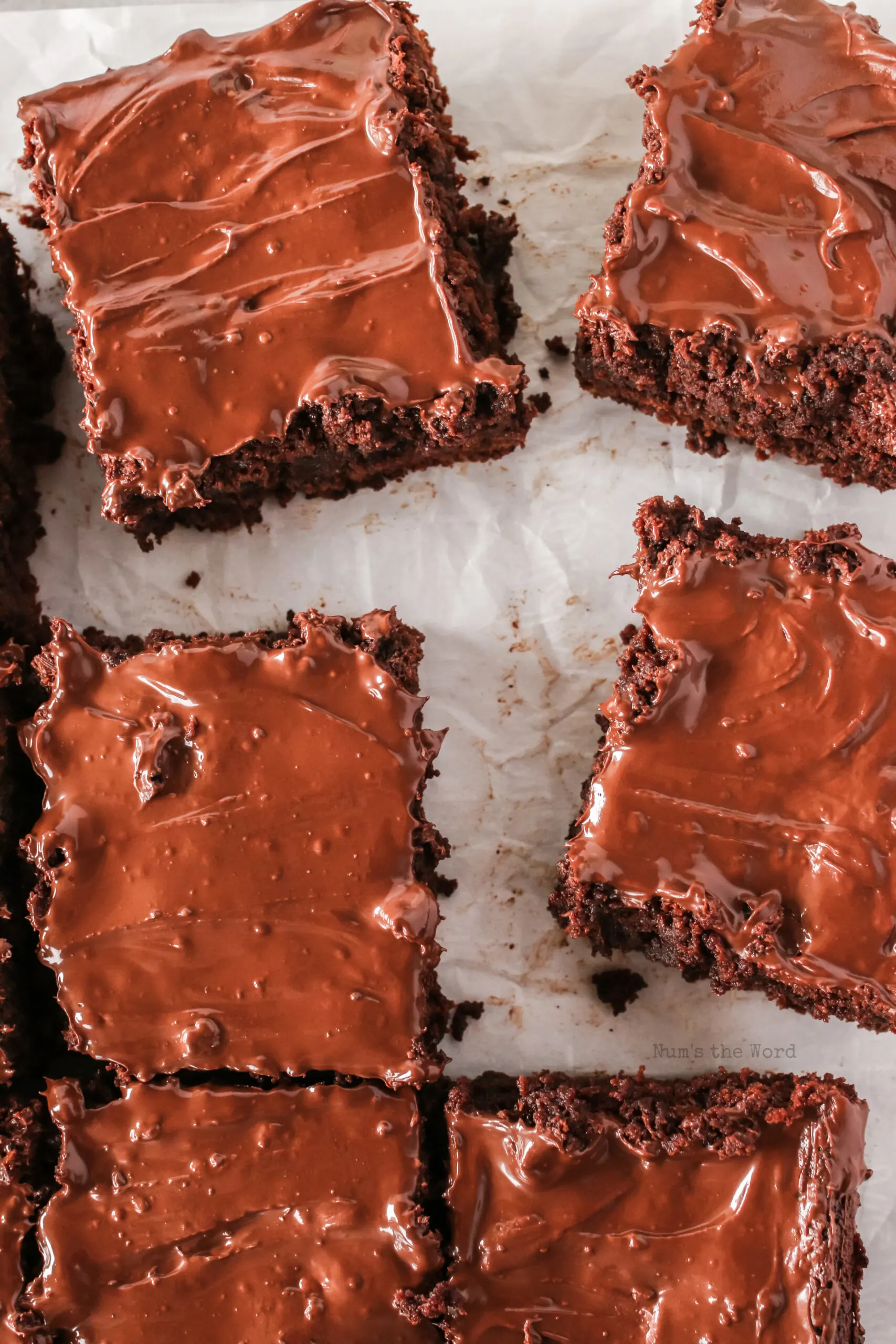 brownies scattered on parchment paper