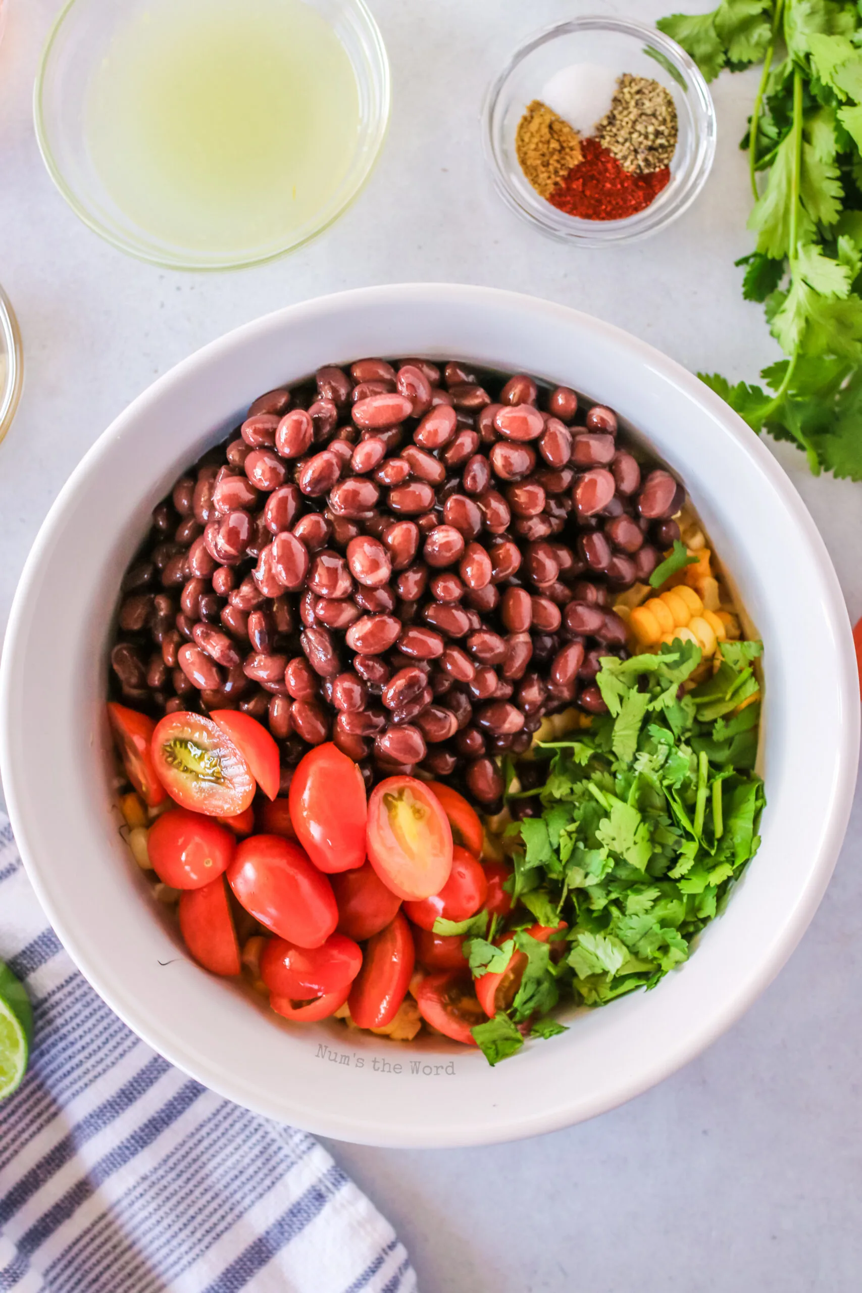 black beans, tomatoes and cilantro addeed to corn.