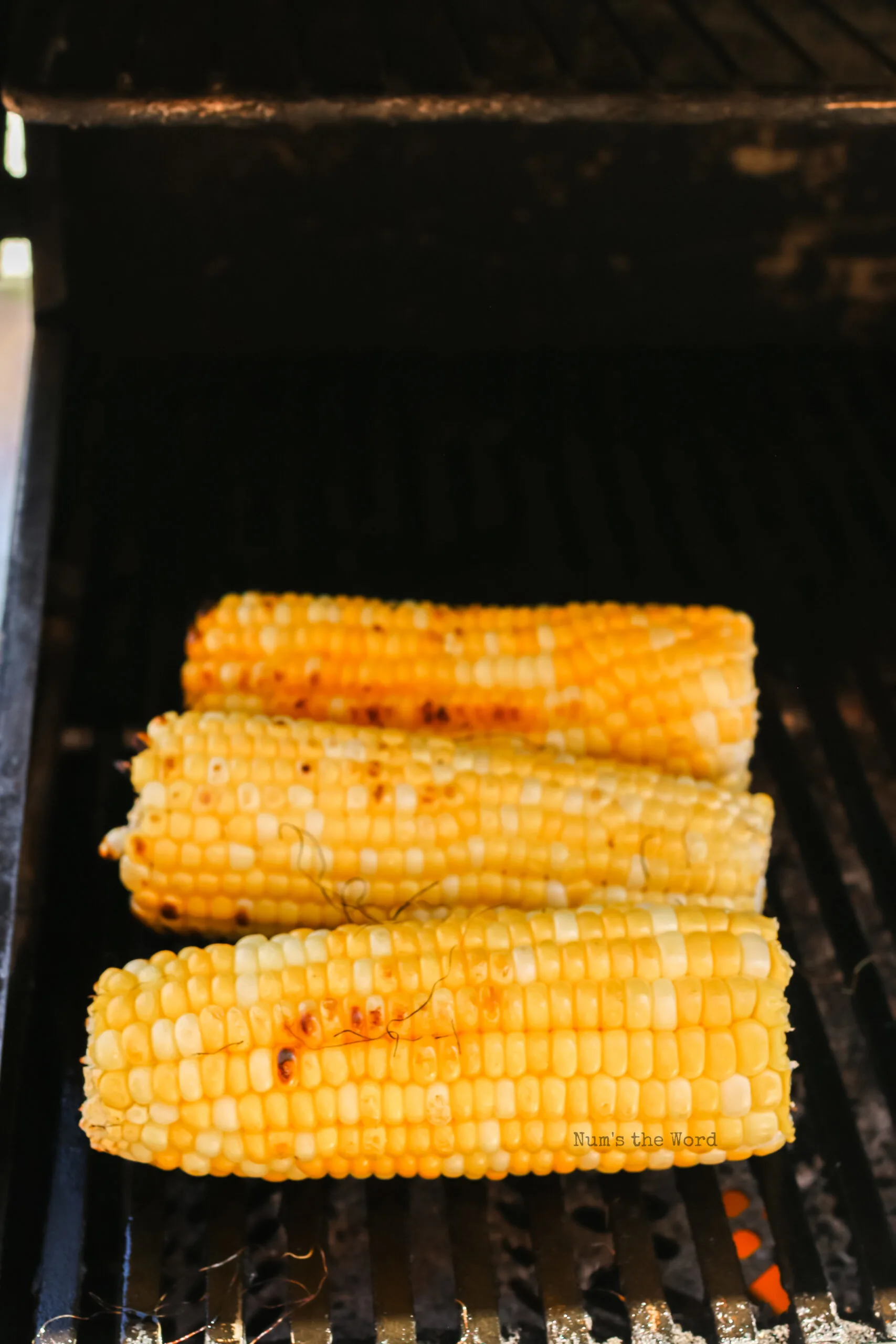 corn cobs removed from foil and charred on grill.