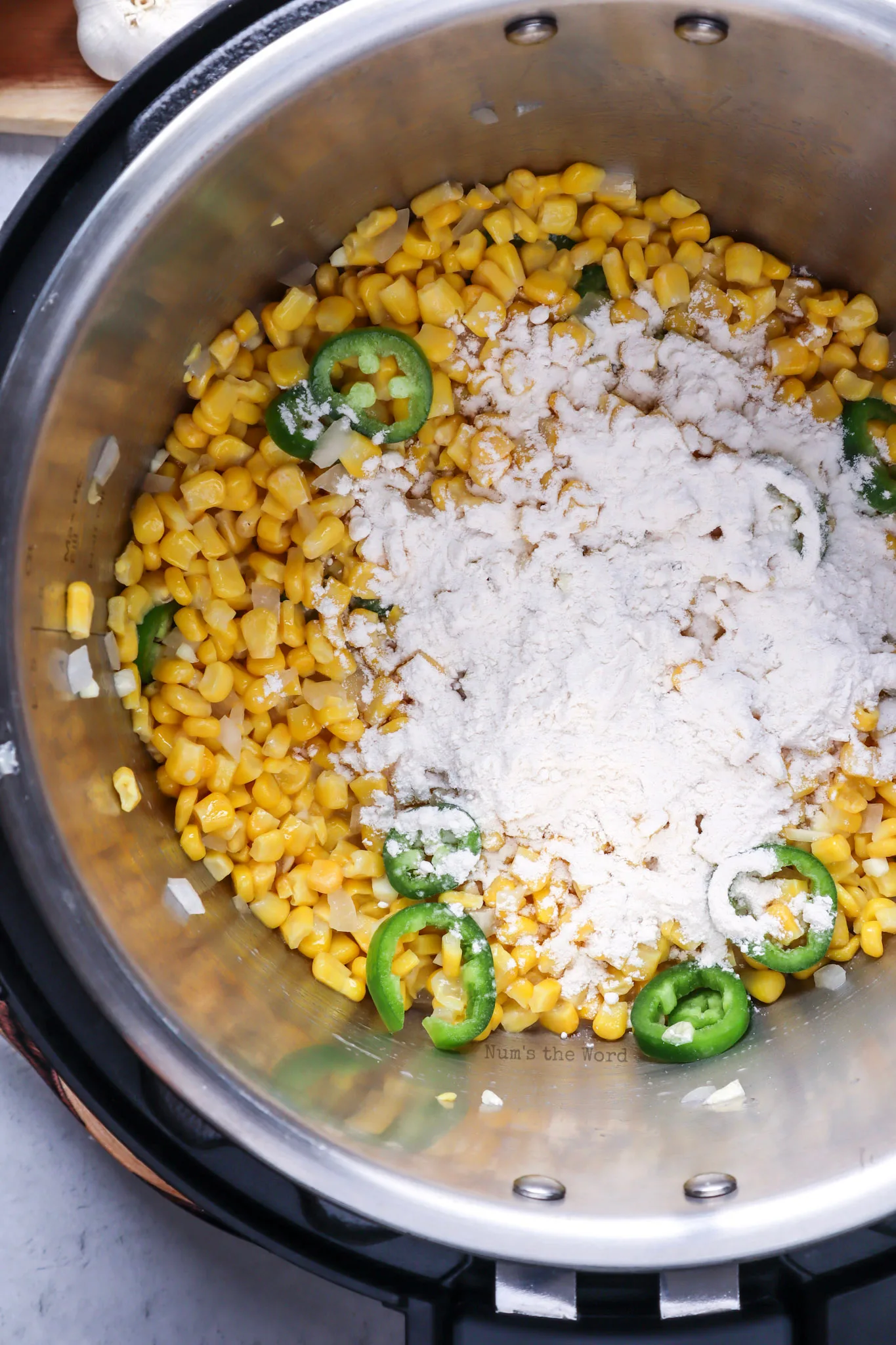 flour and elote seasoning added to corn mixture.